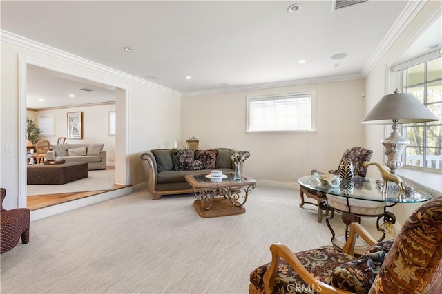 carpeted living area with recessed lighting, visible vents, baseboards, and crown molding