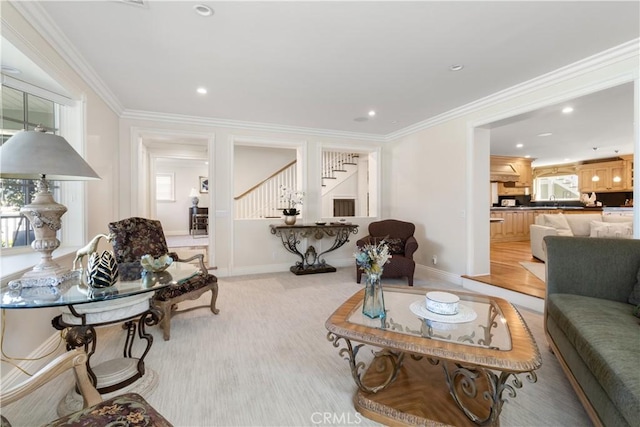 living area with recessed lighting, baseboards, ornamental molding, and stairs