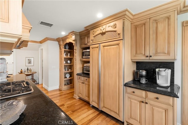 kitchen with visible vents, light wood-style flooring, recessed lighting, ornamental molding, and appliances with stainless steel finishes