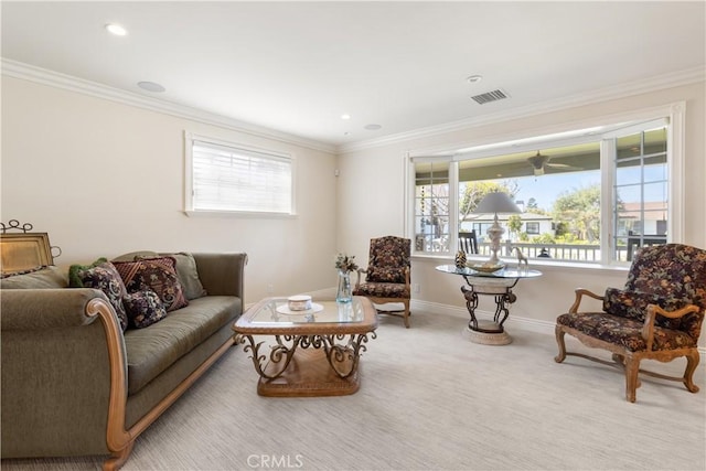 carpeted living area featuring visible vents, recessed lighting, crown molding, and baseboards
