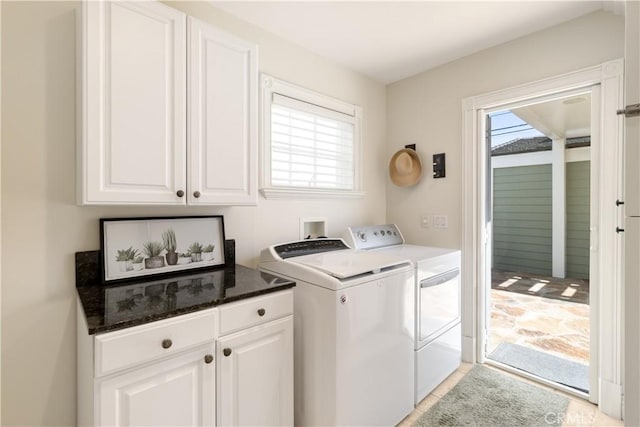 washroom with cabinet space and independent washer and dryer