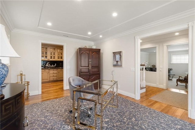 office space featuring recessed lighting, light wood-type flooring, and ornamental molding