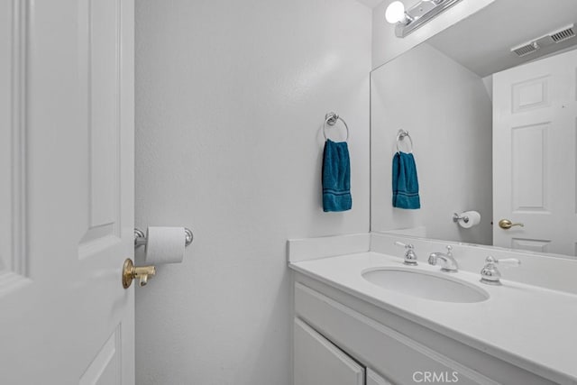 bathroom featuring visible vents and vanity