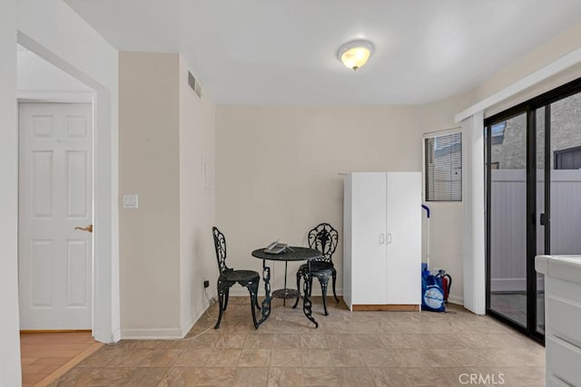 dining space featuring visible vents and baseboards