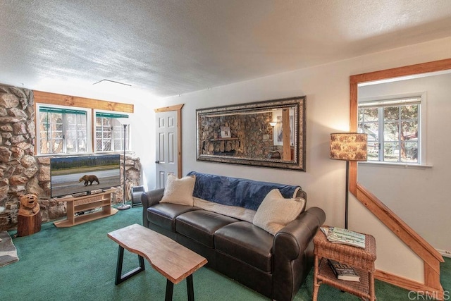 carpeted living room with a textured ceiling