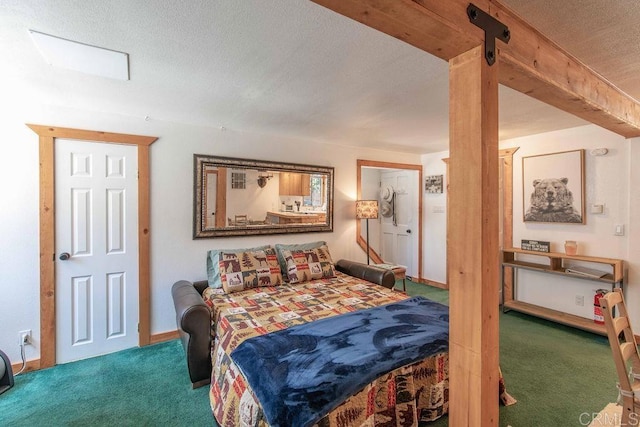 carpeted bedroom with baseboards, a textured ceiling, and beam ceiling