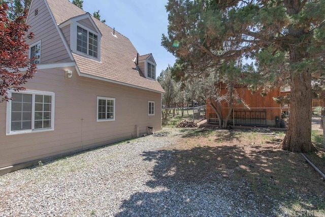 view of side of property with fence