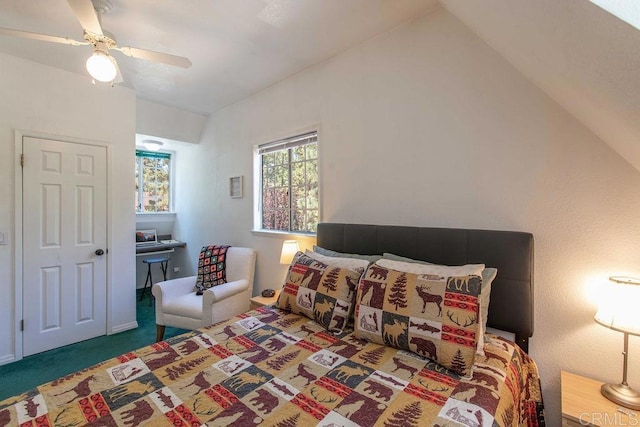 carpeted bedroom featuring vaulted ceiling and ceiling fan