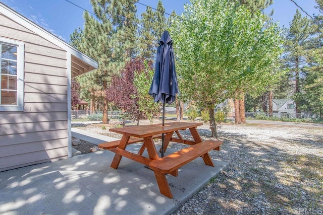 view of patio featuring fence