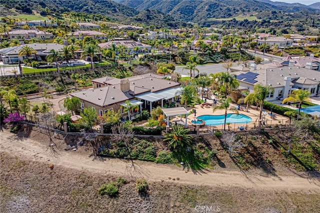 birds eye view of property featuring a mountain view and a residential view