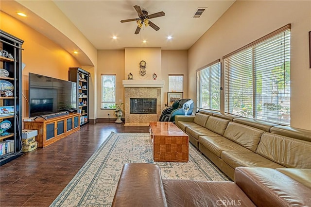 living area with recessed lighting, visible vents, wood finished floors, and a fireplace