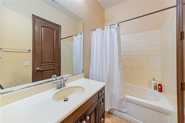 full bathroom featuring tile patterned floors, shower / bath combination with curtain, and vanity