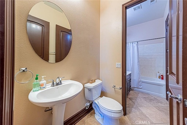 full bath with tile patterned floors, visible vents, toilet, shower / tub combo, and baseboards