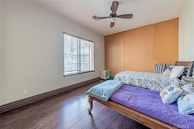 bedroom with wood finished floors, baseboards, and ceiling fan