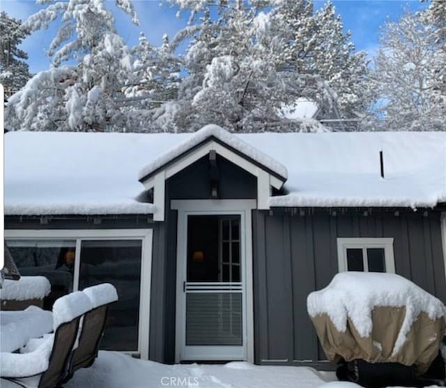 exterior space featuring board and batten siding and a garage