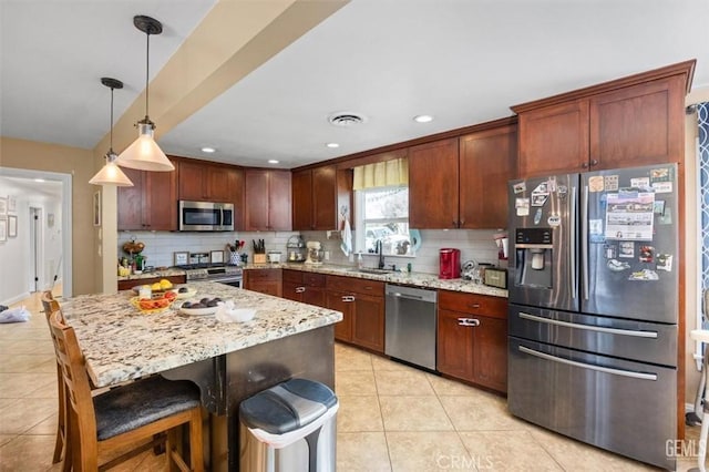 kitchen with backsplash, light tile patterned floors, visible vents, and appliances with stainless steel finishes