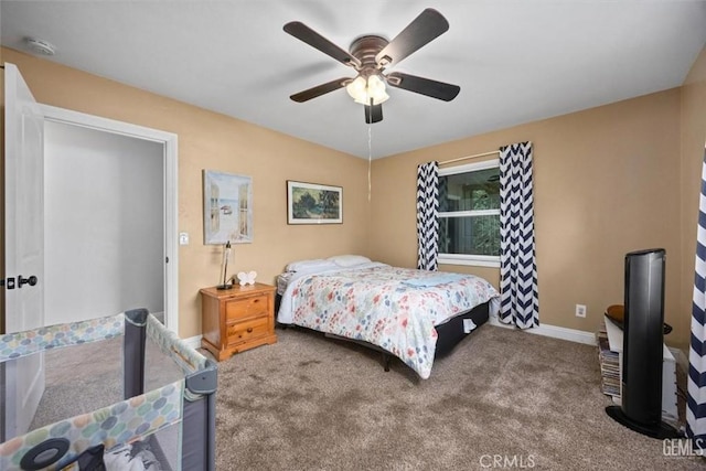 carpeted bedroom with baseboards and ceiling fan