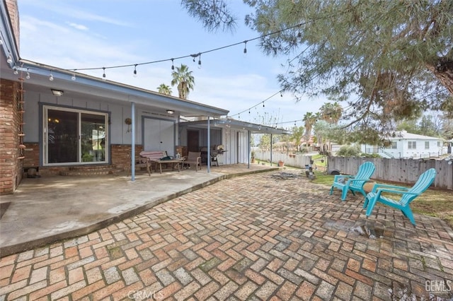 view of patio featuring fence