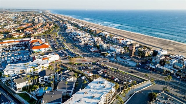 drone / aerial view featuring a view of the beach and a water view