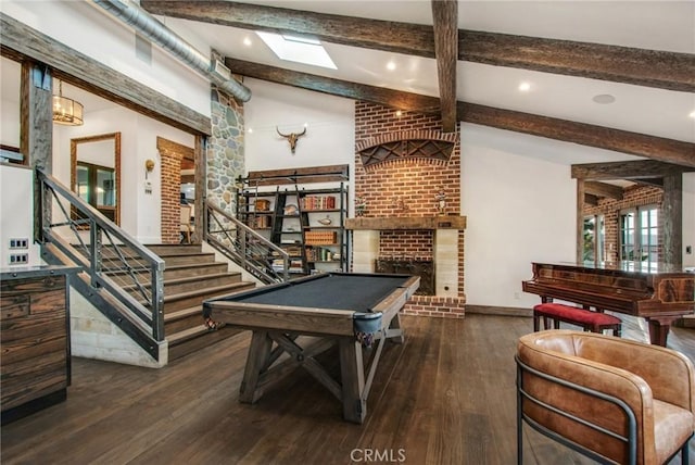 game room with hardwood / wood-style floors, billiards, baseboards, lofted ceiling with beams, and a fireplace