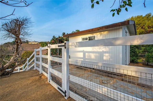 exterior space featuring fence and a gate