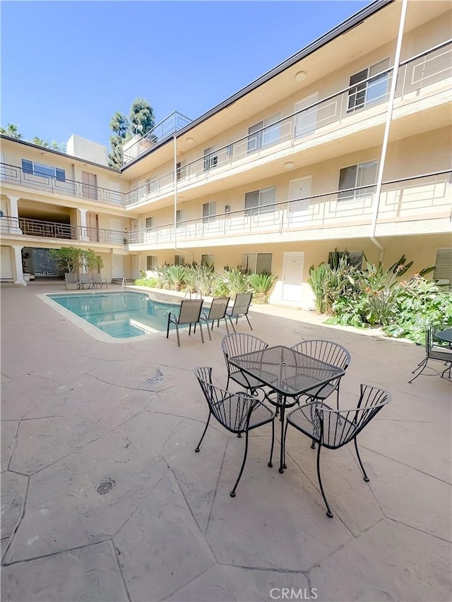 pool with a patio