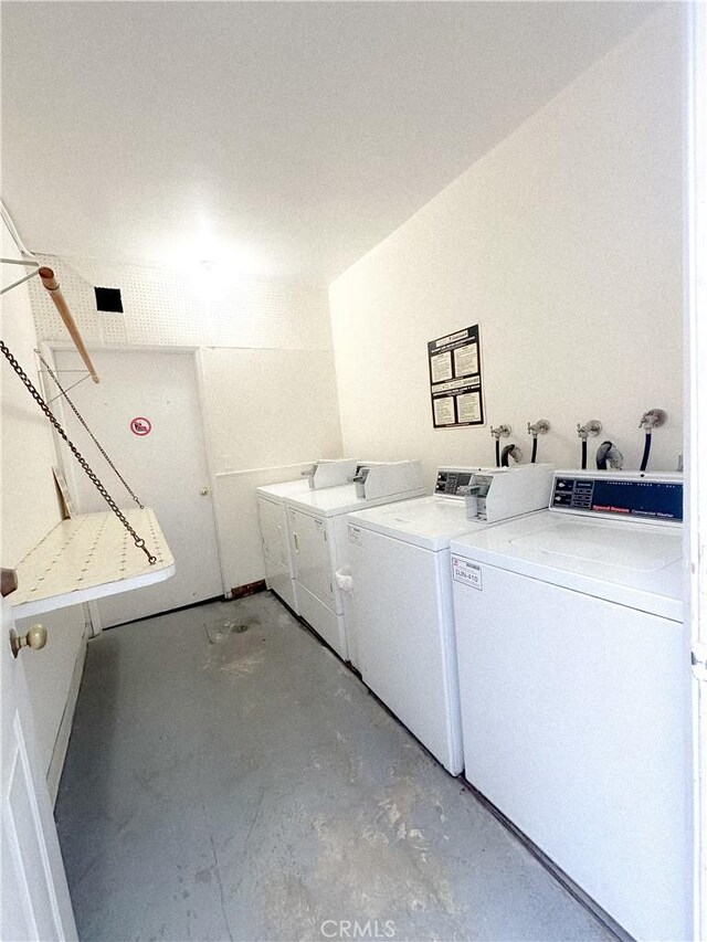 common laundry area with separate washer and dryer