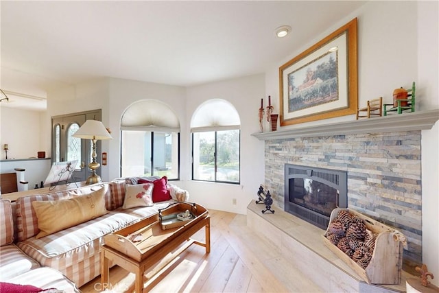 2139 Verde Canyon Rd, Arroyo Grande, CA 93420 - living room with light wood-type flooring, a stone fireplace, and recessed lighting