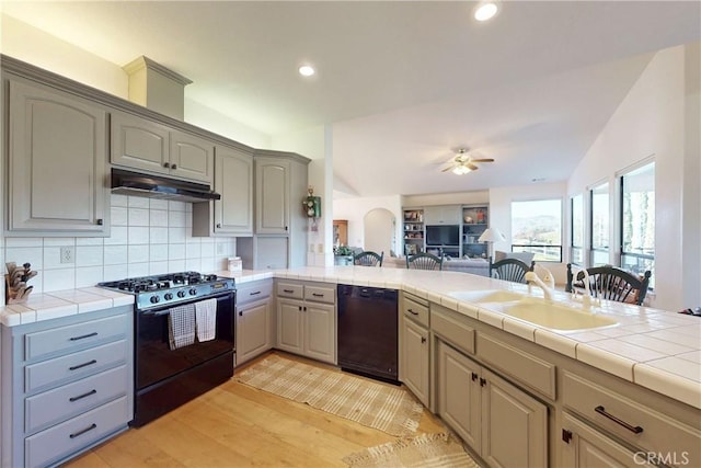 2139 Verde Canyon Rd, Arroyo Grande, CA 93420 - kitchen featuring range with gas stovetop, dishwasher, under cabinet range hood, open floor plan, and a peninsula