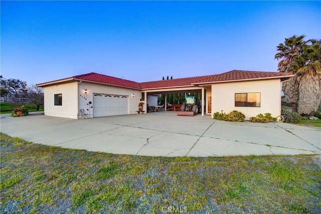 2139 Verde Canyon Rd, Arroyo Grande, CA 93420 - view of front of home featuring a garage, stucco siding, a tiled roof, and concrete driveway