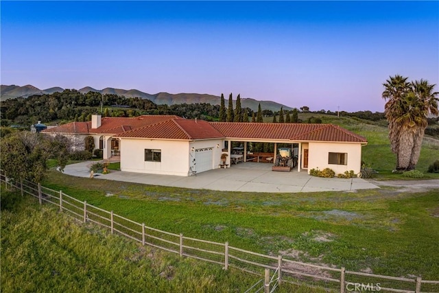 2139 Verde Canyon Rd, Arroyo Grande, CA 93420 - view of front of home with a tile roof, an attached garage, driveway, a chimney, and a mountain view