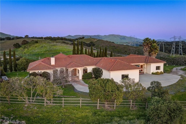 2139 Verde Canyon Rd, Arroyo Grande, CA 93420 - view of front facade with a tiled roof, a mountain view, and stucco siding
