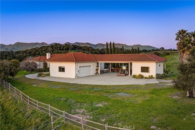 2139 Verde Canyon Rd, Arroyo Grande, CA 93420 - view of front of house featuring a tile roof, concrete driveway, an attached garage, stucco siding, and a mountain view