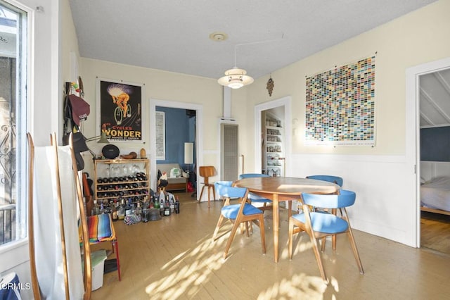 dining area with wood finished floors