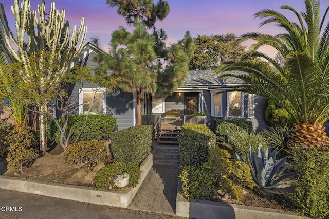 obstructed view of property with covered porch