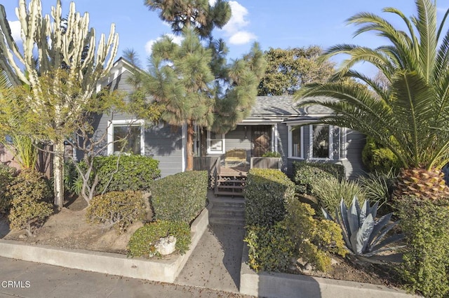 obstructed view of property with covered porch