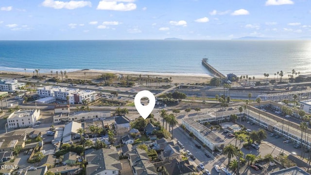 bird's eye view featuring a beach view and a water view