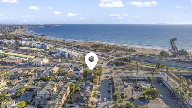 birds eye view of property featuring a view of the beach and a water view