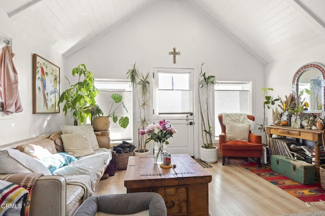 interior space featuring beamed ceiling, high vaulted ceiling, wood finished floors, and wooden ceiling