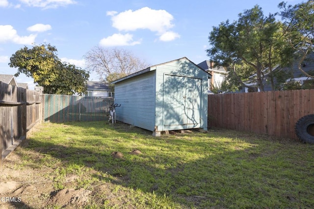 view of shed with a fenced backyard