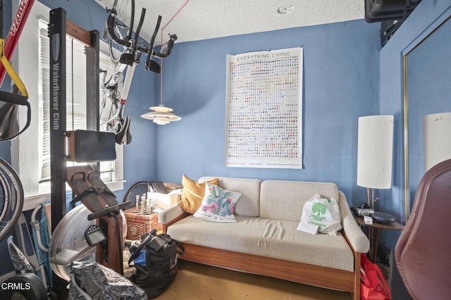 living area with a textured ceiling