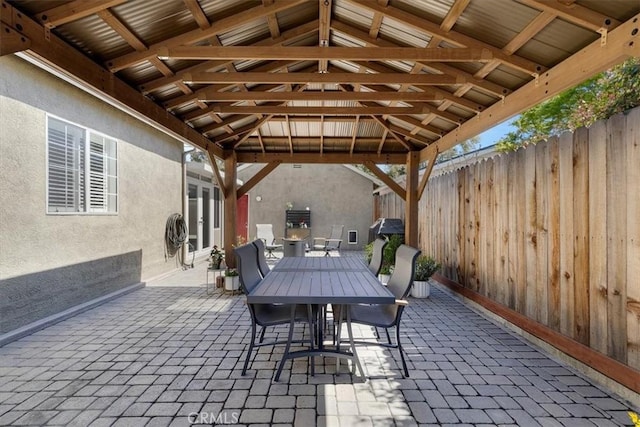 view of patio / terrace with outdoor dining area and fence