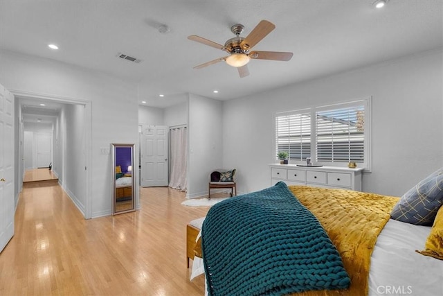 bedroom with recessed lighting, visible vents, baseboards, and light wood finished floors