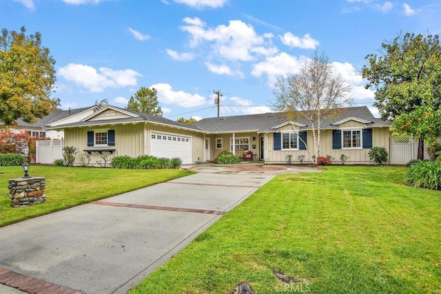 ranch-style home featuring board and batten siding, a front lawn, fence, concrete driveway, and a garage