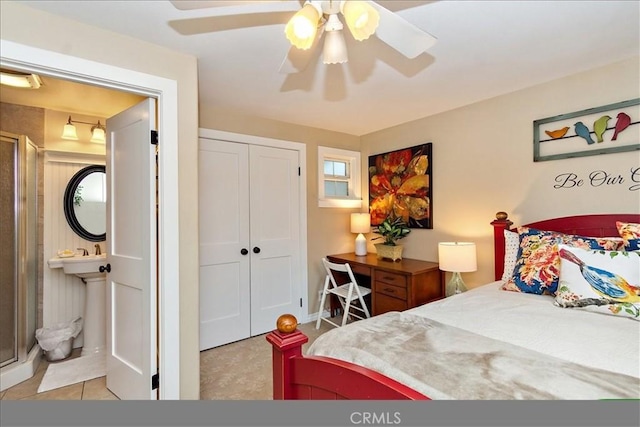 bedroom featuring connected bathroom, a closet, and ceiling fan