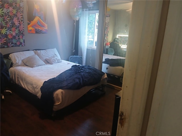 bedroom featuring wood finished floors