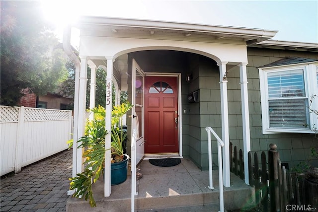 property entrance featuring fence