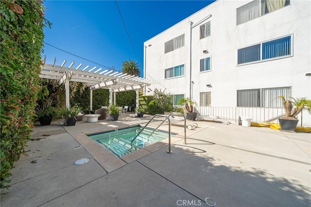 view of pool featuring a patio, a pergola, and a hot tub