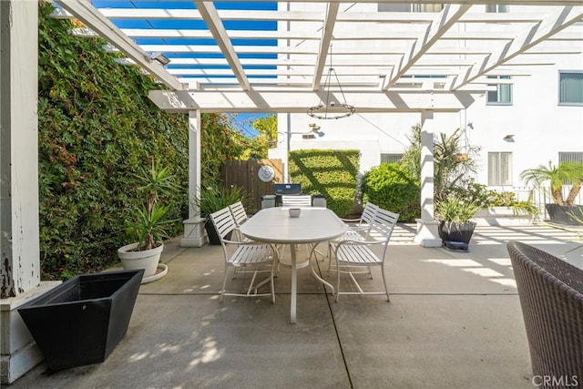 view of patio featuring outdoor dining space and a pergola