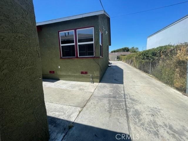 10807 Compton Ave, Los Angeles, CA 90059 - view of home's exterior featuring stucco siding and crawl space